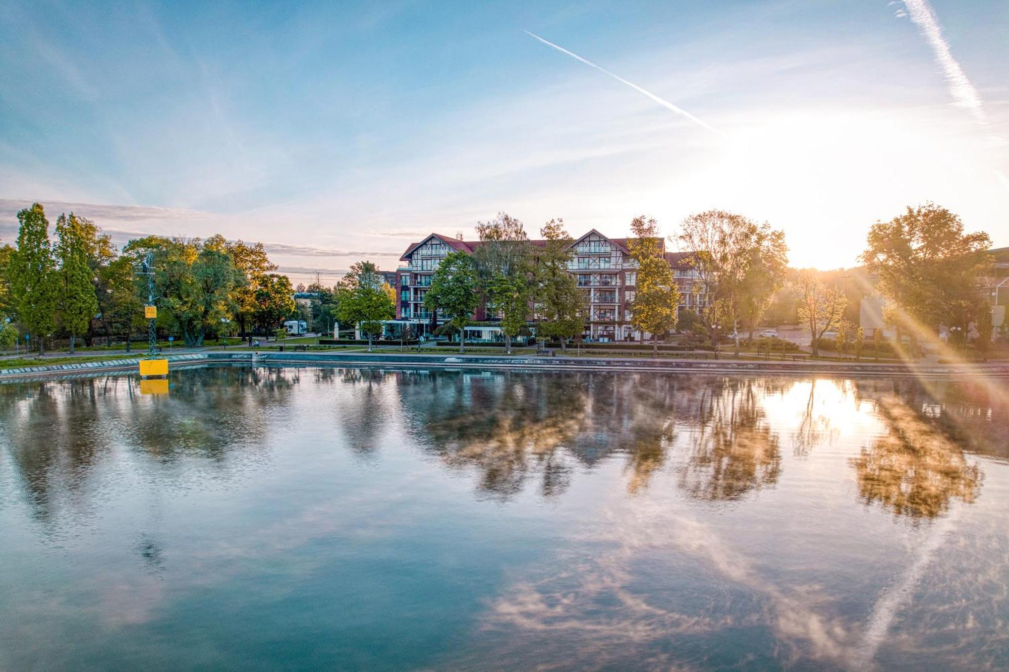 Willa Port Ostróda Exteriör bild The lake at the campus of the University of Applied Sciences and Medical University of Southern Tyrol